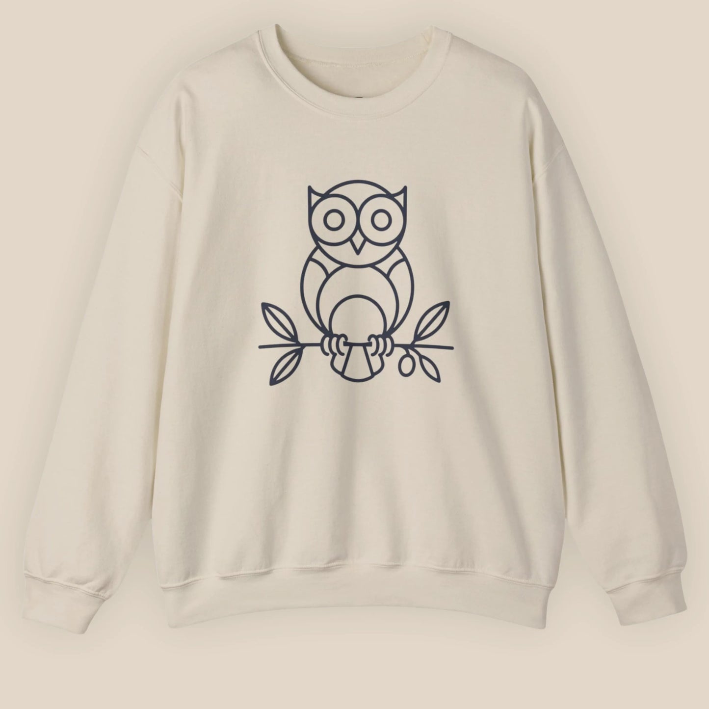 Flat lay of Sand Owl ‘Wisdom’ sweatshirt, front-facing with owl and olive branch print centered