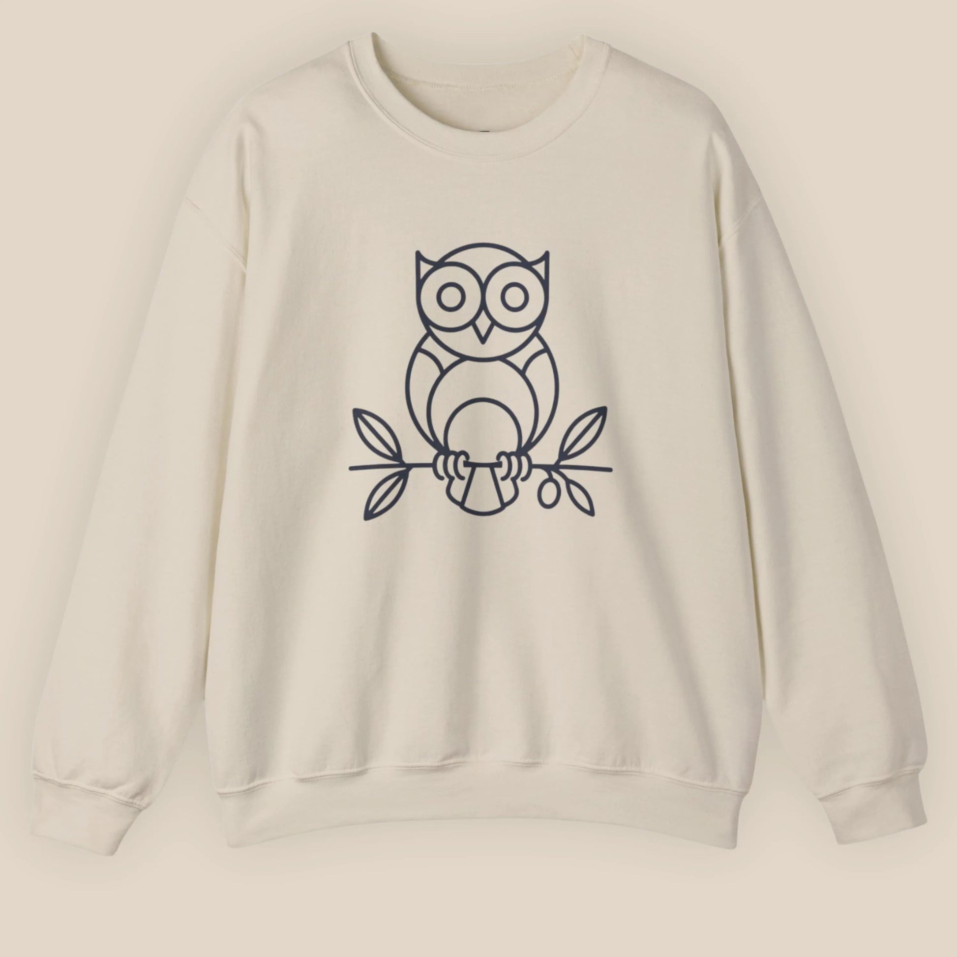 Flat lay of Sand Owl ‘Wisdom’ sweatshirt, front-facing with owl and olive branch print centered