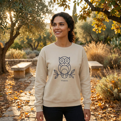 Lifestyle photo in autumn park wearing Owl ‘Wisdom’ sweatshirt with owl and olive branch graphic visible