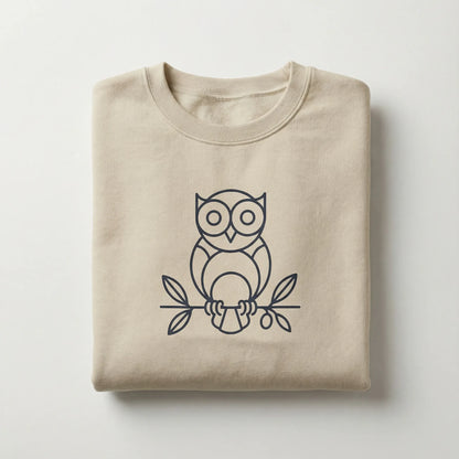 Folded Owl ‘Wisdom’ sweatshirt with minimalist owl motif visible on top