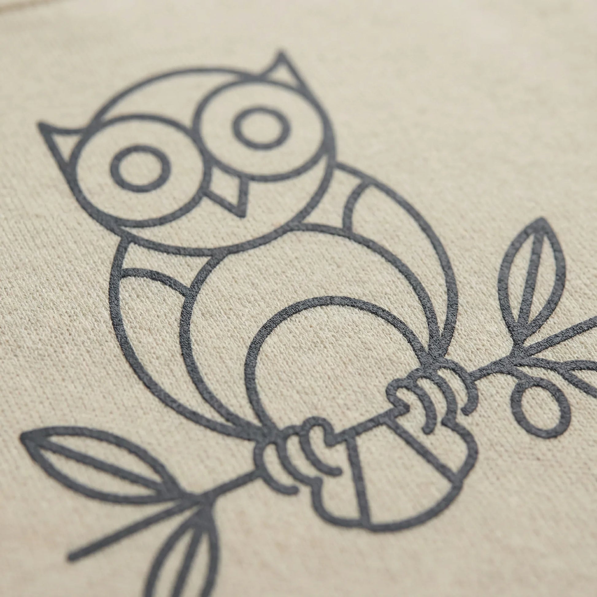 Close-up of DTG print on Owl ‘Wisdom’ sweatshirt showing line-art owl and fabric texture