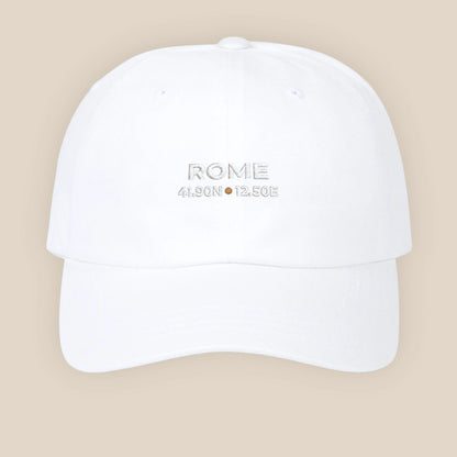 White cap with 'ROME' and coordinates on a beige background