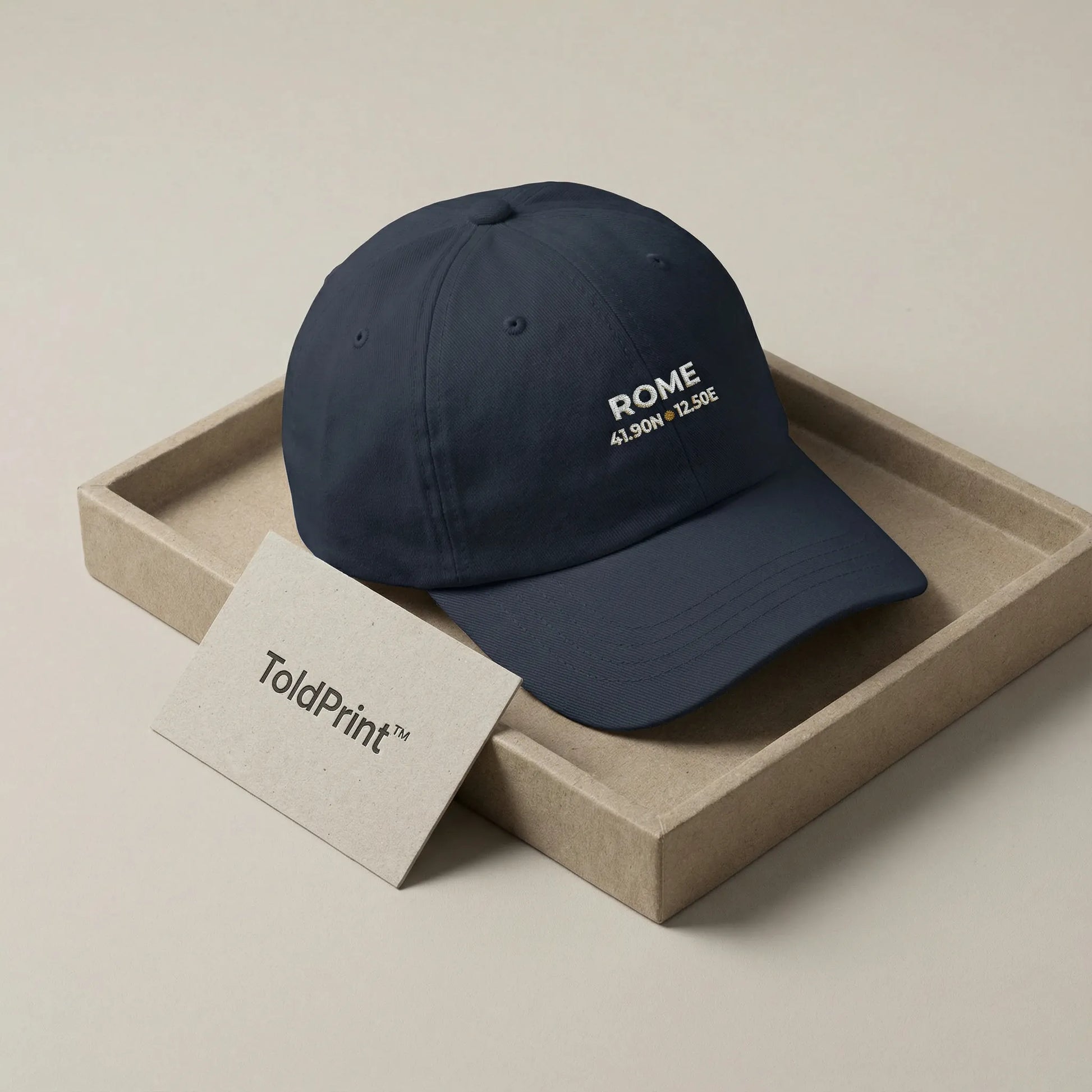 Navy blue cap with 'ROME' text on a beige tray, featuring ToldPrint branding.