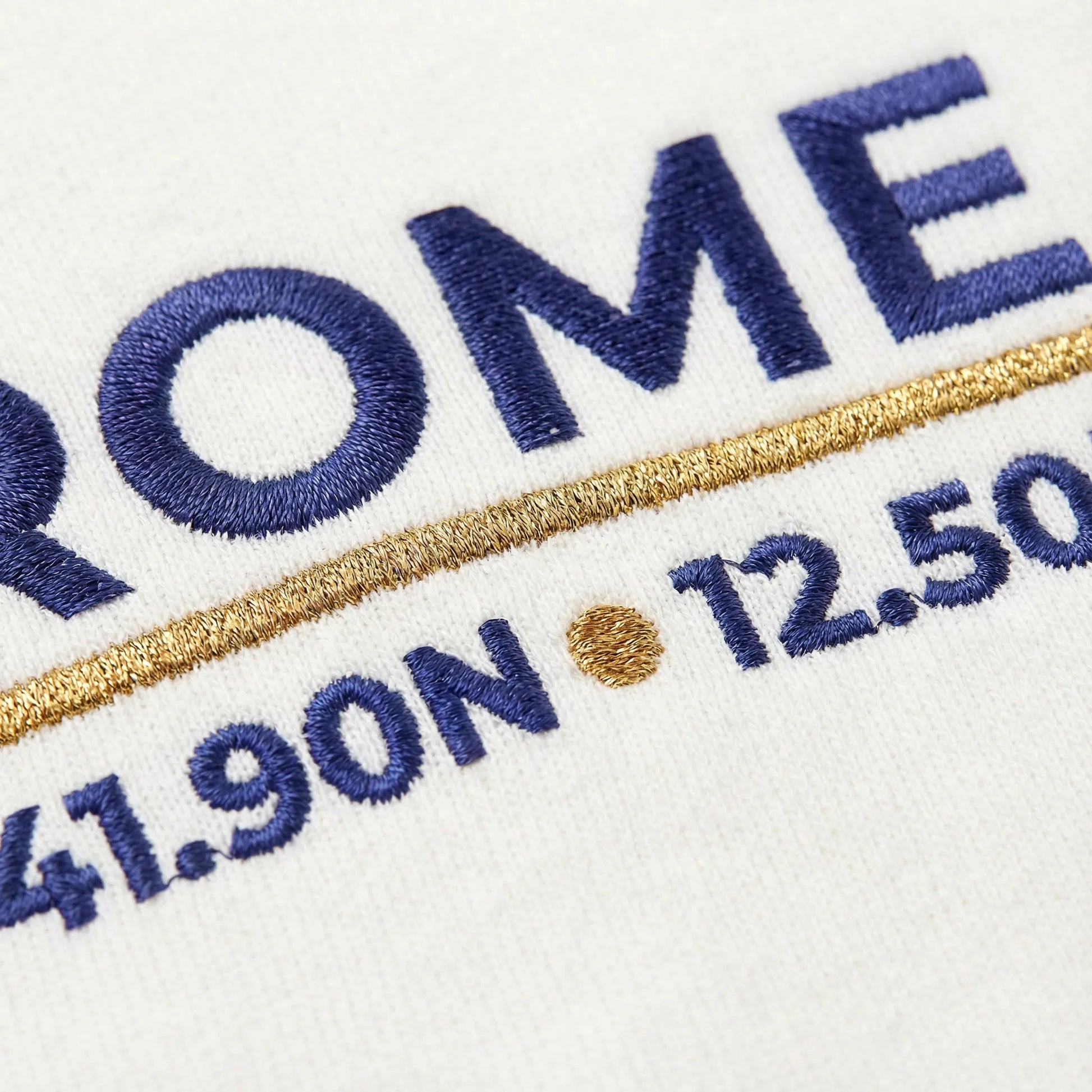 Macro close-up of Rome coordinates embroidery stitches on sweatshirt