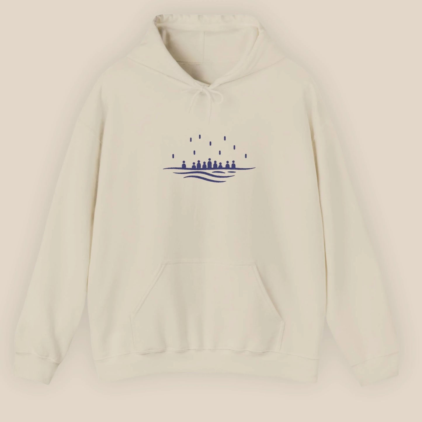 Flat lay of the sand Sea Crossing hoodie