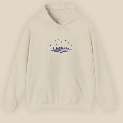 Flat lay of the sand Sea Crossing hoodie