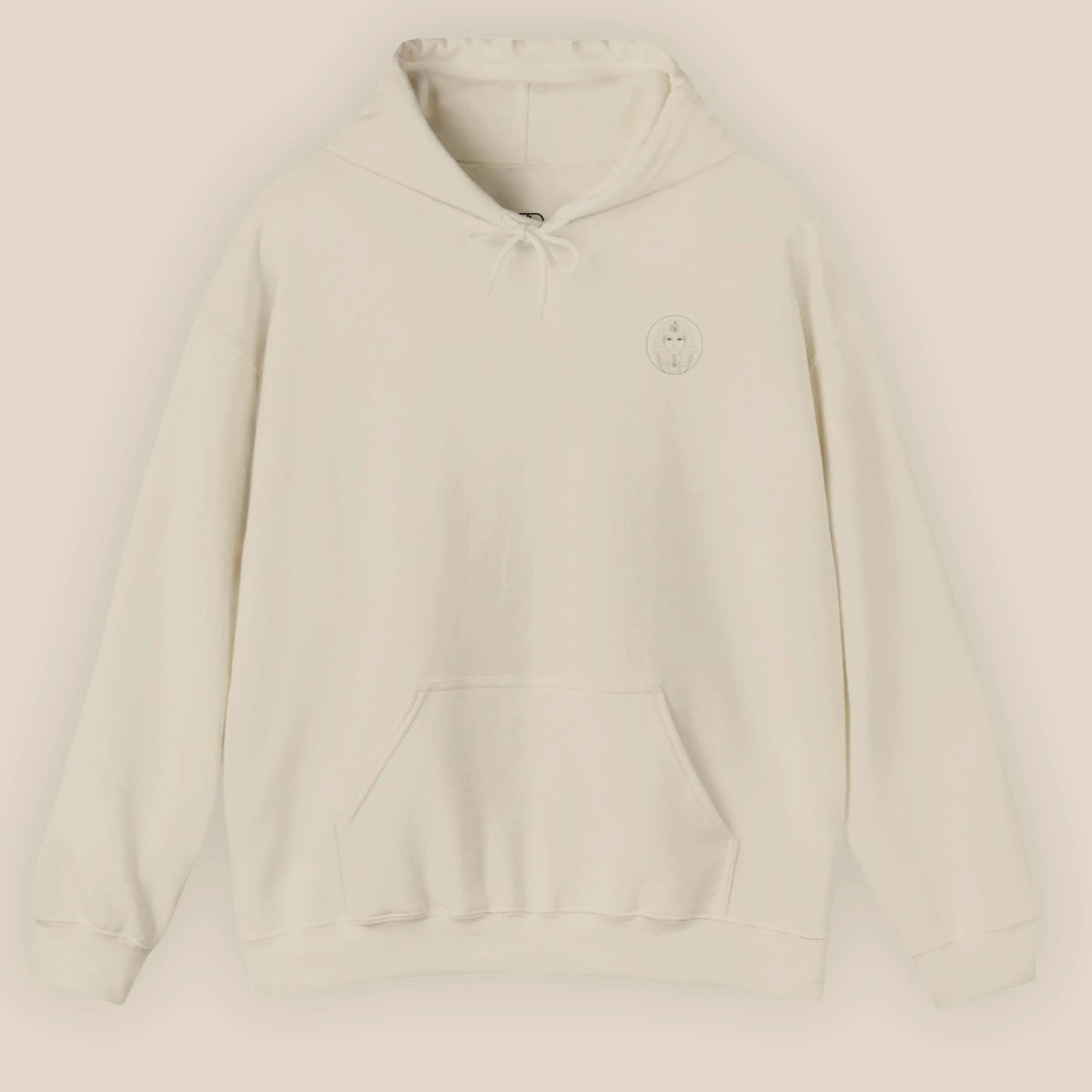 Flat lay of sand Sphinx graphic hoodie showing chest Sphinx badge on neutral background