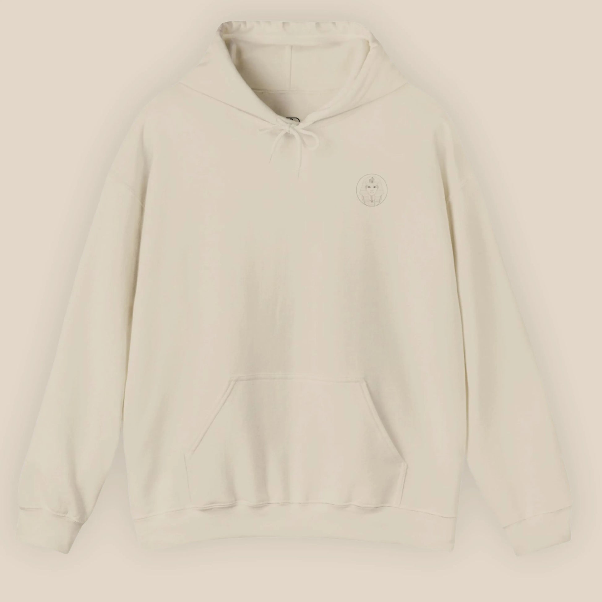 Flat lay of sand Sphinx graphic hoodie showing chest Sphinx badge on neutral background