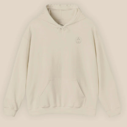 Flat lay of sand Sphinx graphic hoodie showing chest Sphinx badge on neutral background