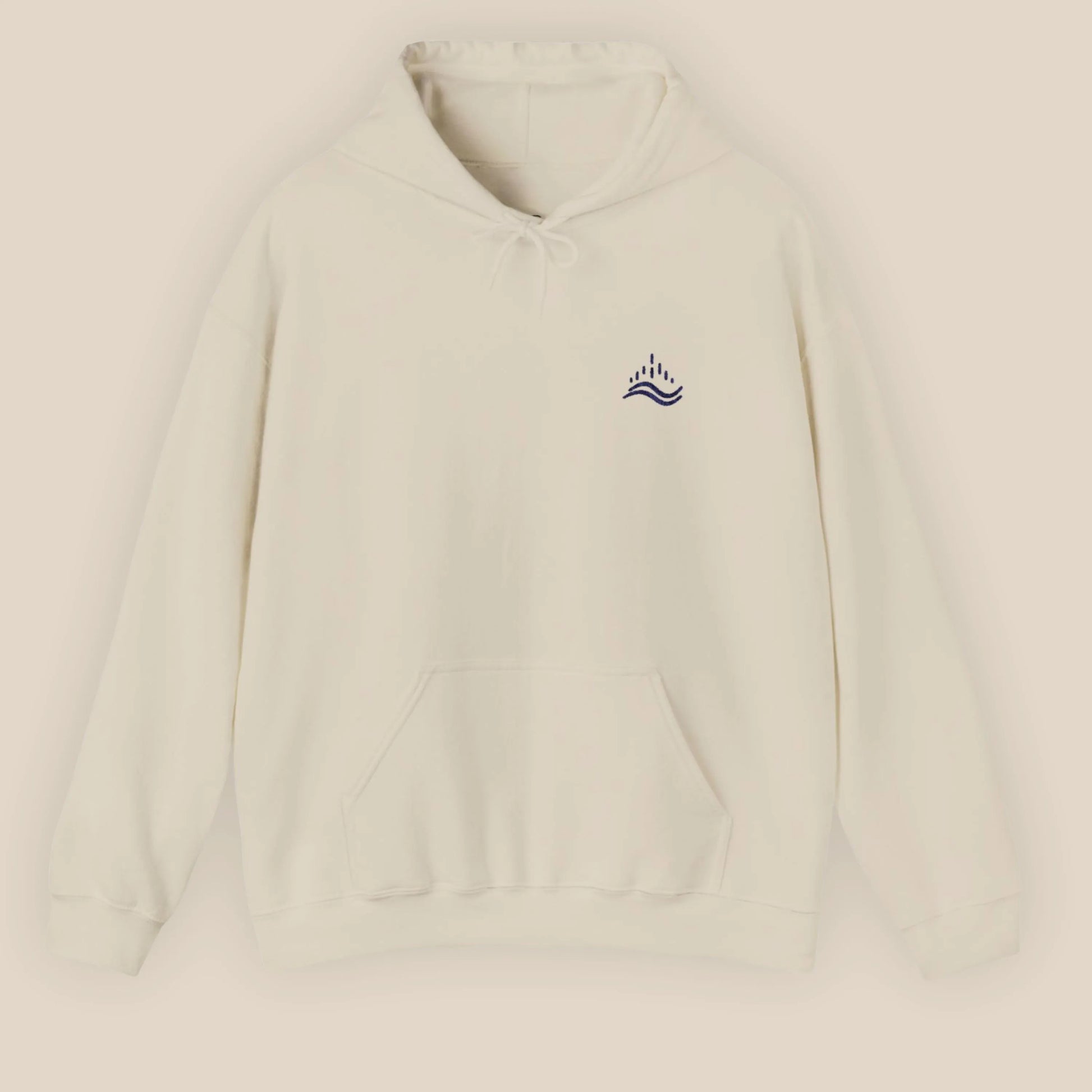 Sand unisex hoodie with small navy waves emblem embroidered on the left chest, photographed front view in a beige background