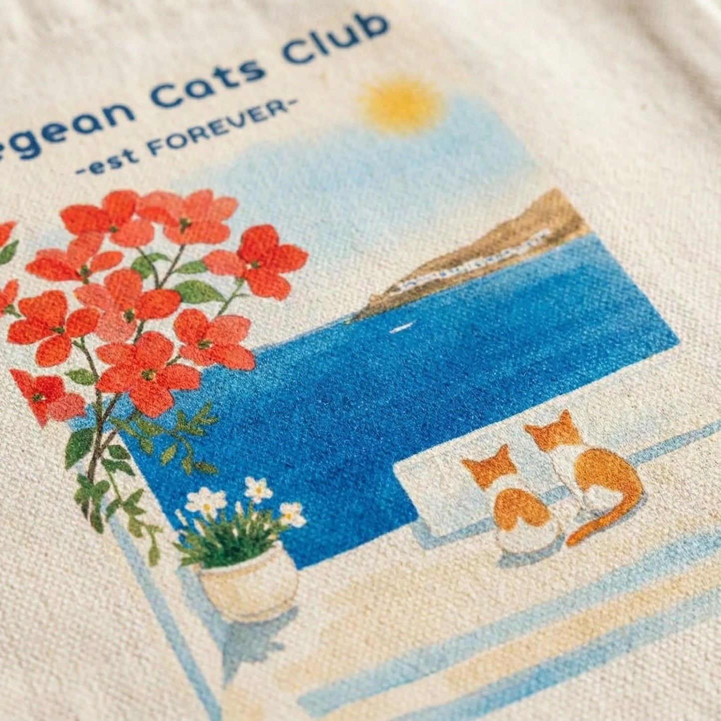 Close-up of Aegean Cats Club cat artwork printed on canvas tote bag