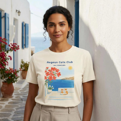 Aegean Cats Club t-shirt worn by model near a Greek island whitewashed wall
