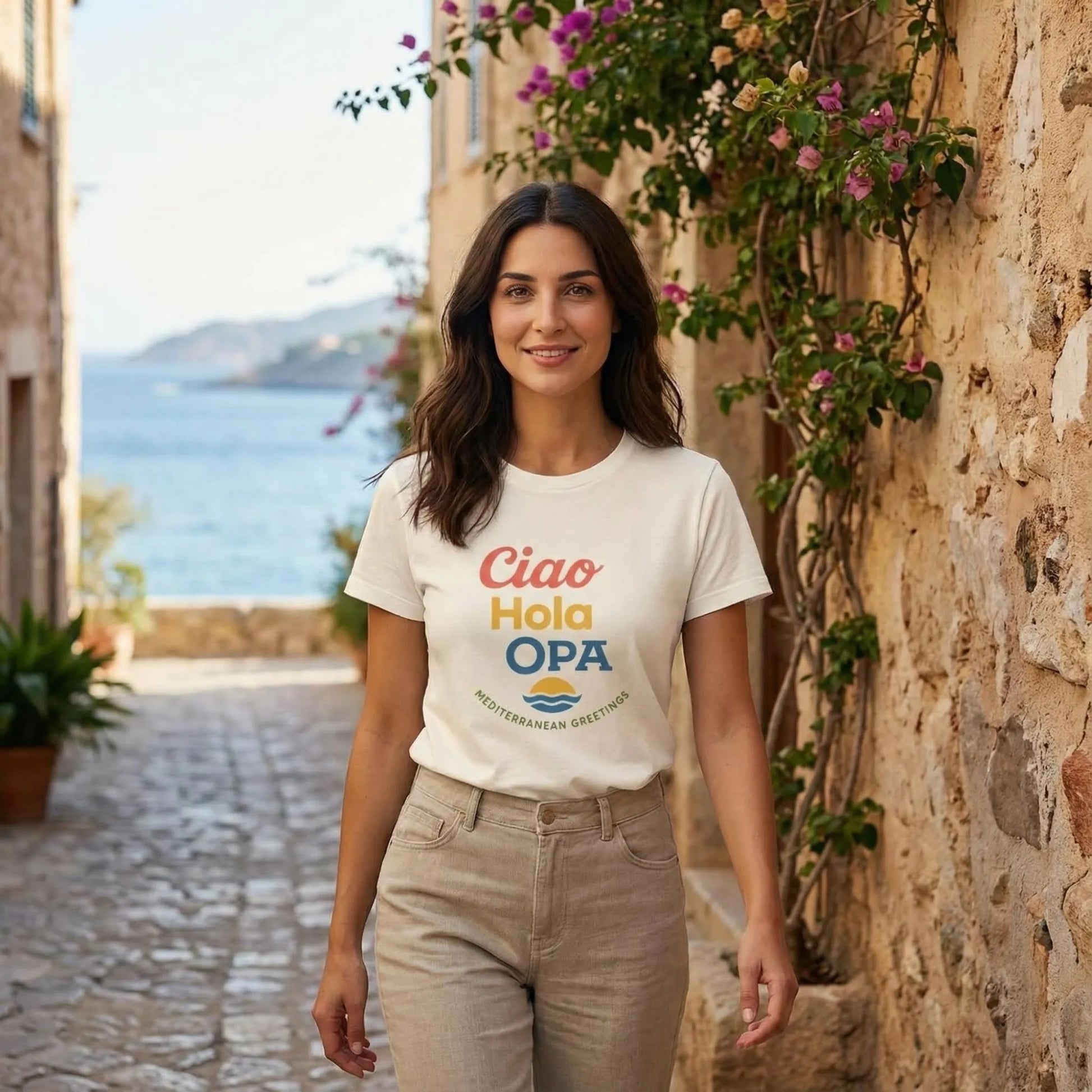Ciao Hola OPA greeting t-shirt worn by model walking in a Mediterranean alley