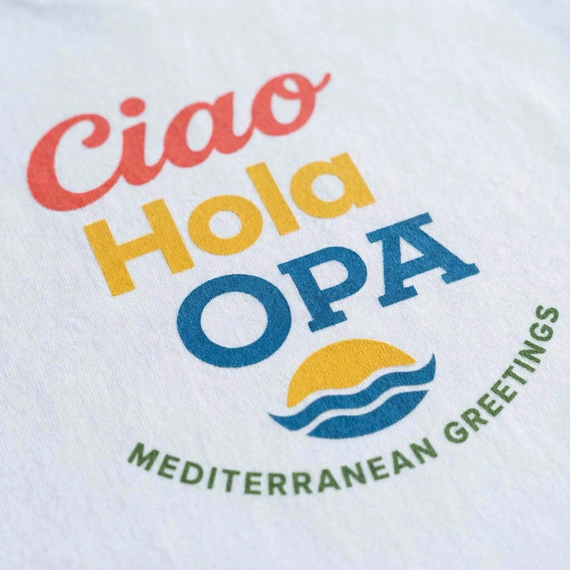 Close-up of Ciao Hola OPA stacked greeting print on unisex t-shirt