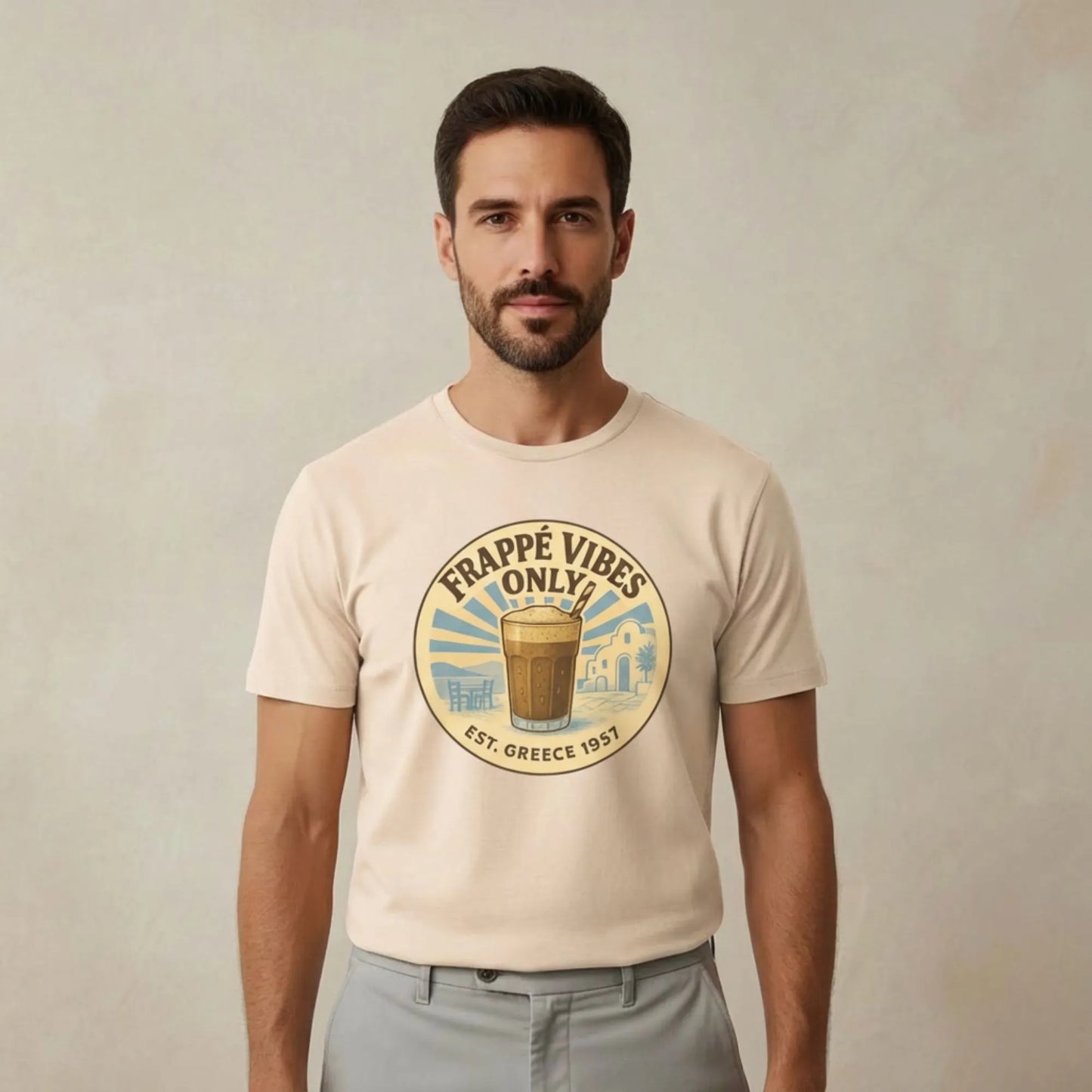 TP:HERO Model wearing Frappé Vibes Only Greek coffee t-shirt by ToldPrint in a calm Mediterranean studio setting