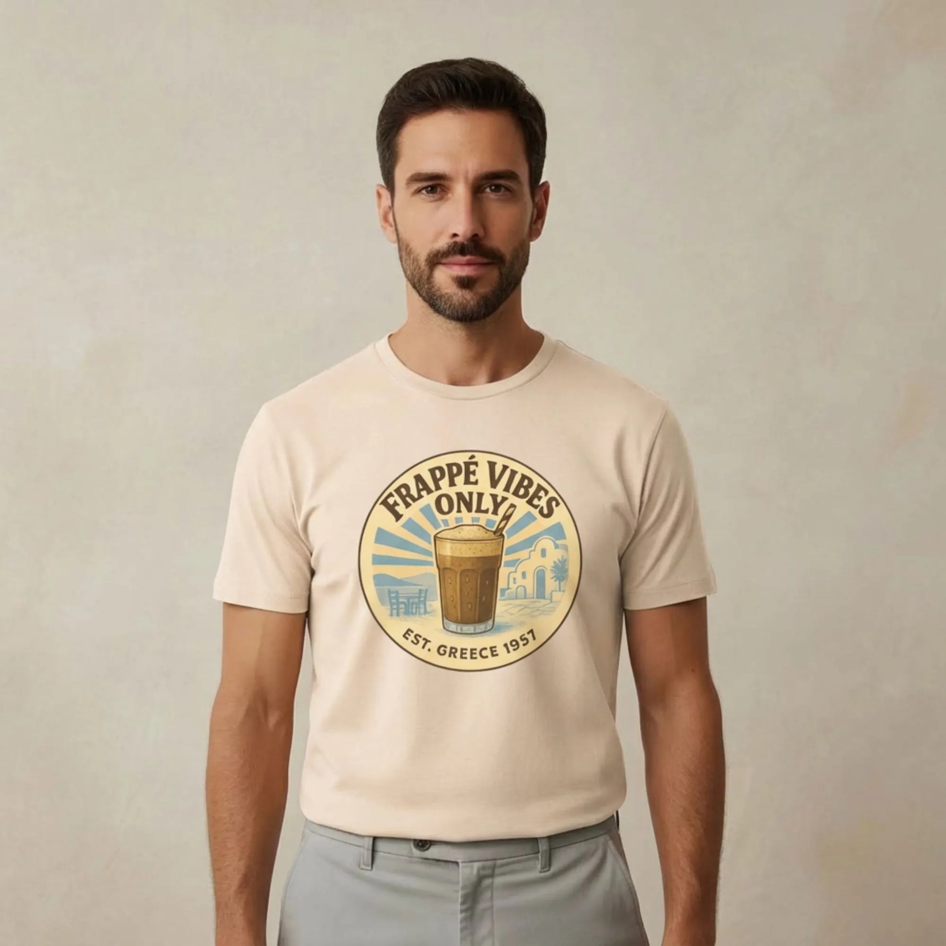 TP:HERO Model wearing Frappé Vibes Only Greek coffee t-shirt by ToldPrint in a calm Mediterranean studio setting