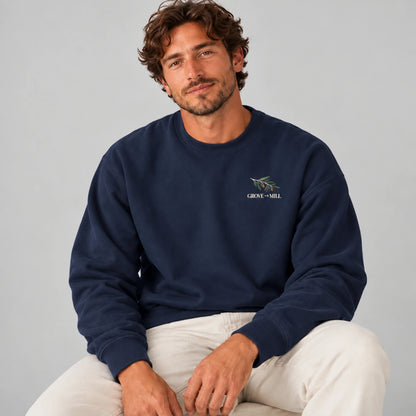 Male model wearing the True Navy Grove to Mill sweatshirt from the front, showing the small Grove to Mill olive-branch left-chest print.