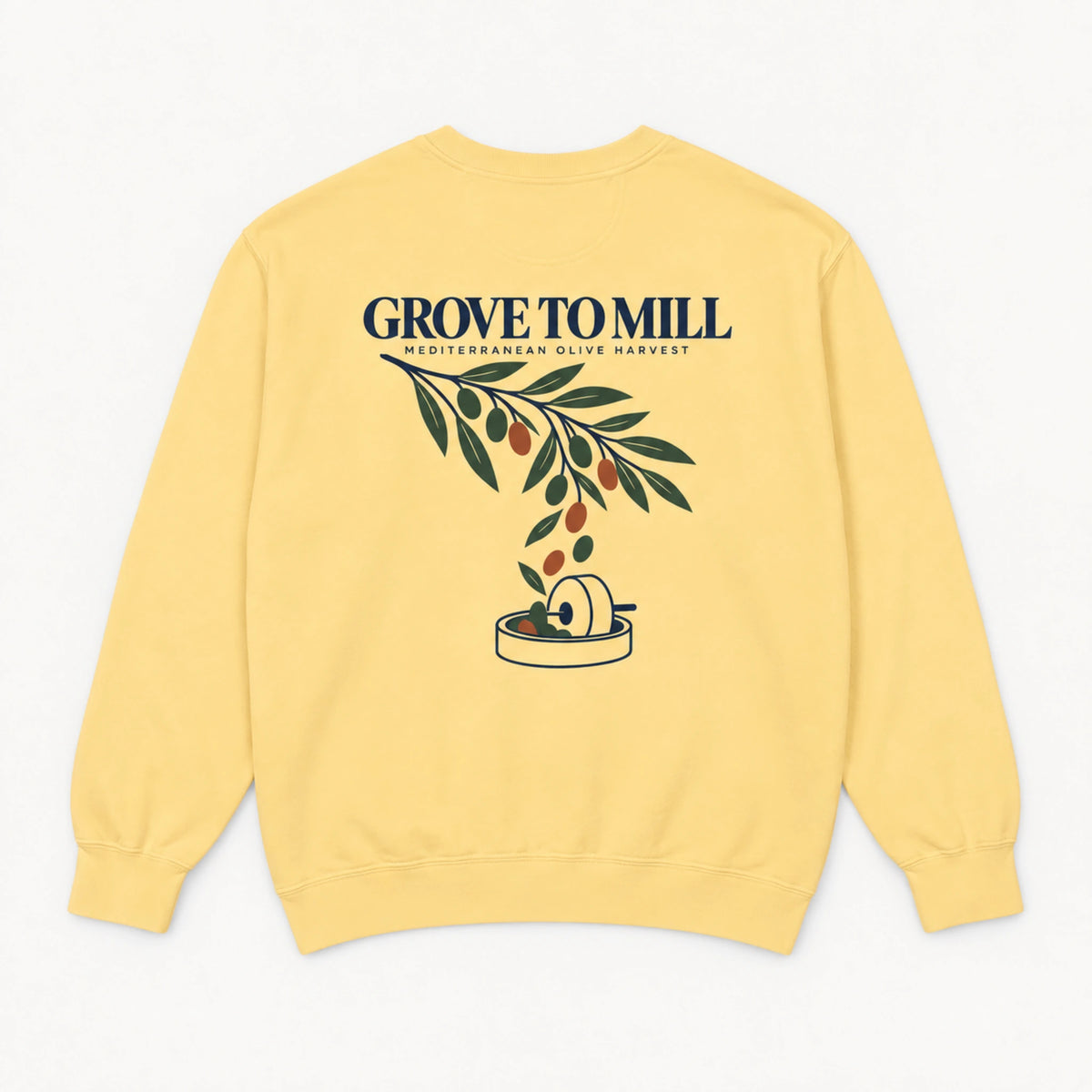 Butter Grove to Mill Comfort Colors 1566 sweatshirt shown from the back with the Mediterranean Olive Harvest olive-branch and millstone print.