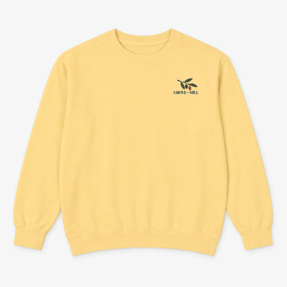 Butter Grove to Mill Comfort Colors 1566 sweatshirt flat lay, front view with the dark olive Grove to Mill left-chest print.