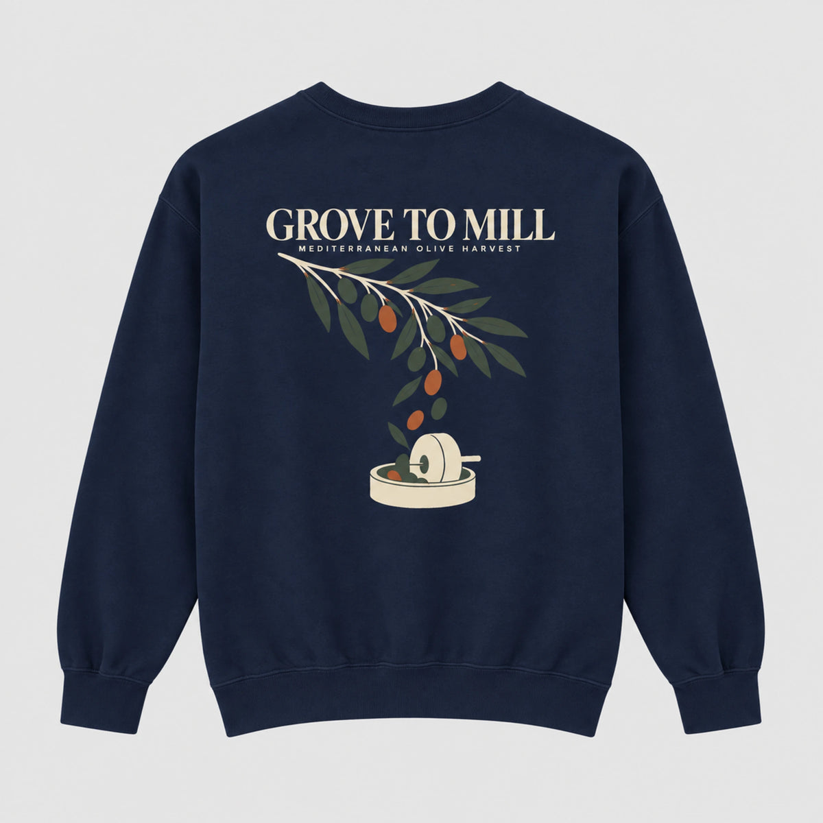A navy blue crewneck sweatshirt featuring a graphic print of an olive branch with olives and a grinding mill, with the text 'GROVE TO MILL' and 'MEDITERRANEAN OLIVE HARVEST' printed above it.