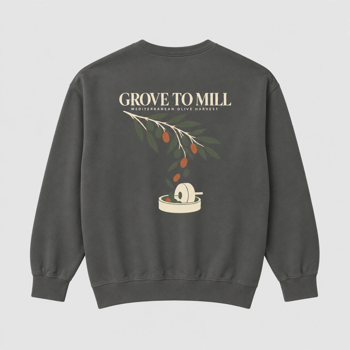 A dark gray crewneck sweatshirt shown from the back, featuring a graphic print of an olive branch with olives and a grinding mill, with the text 'GROVE TO MILL' and 'MEDITERRANEAN OLIVE HARVEST'.