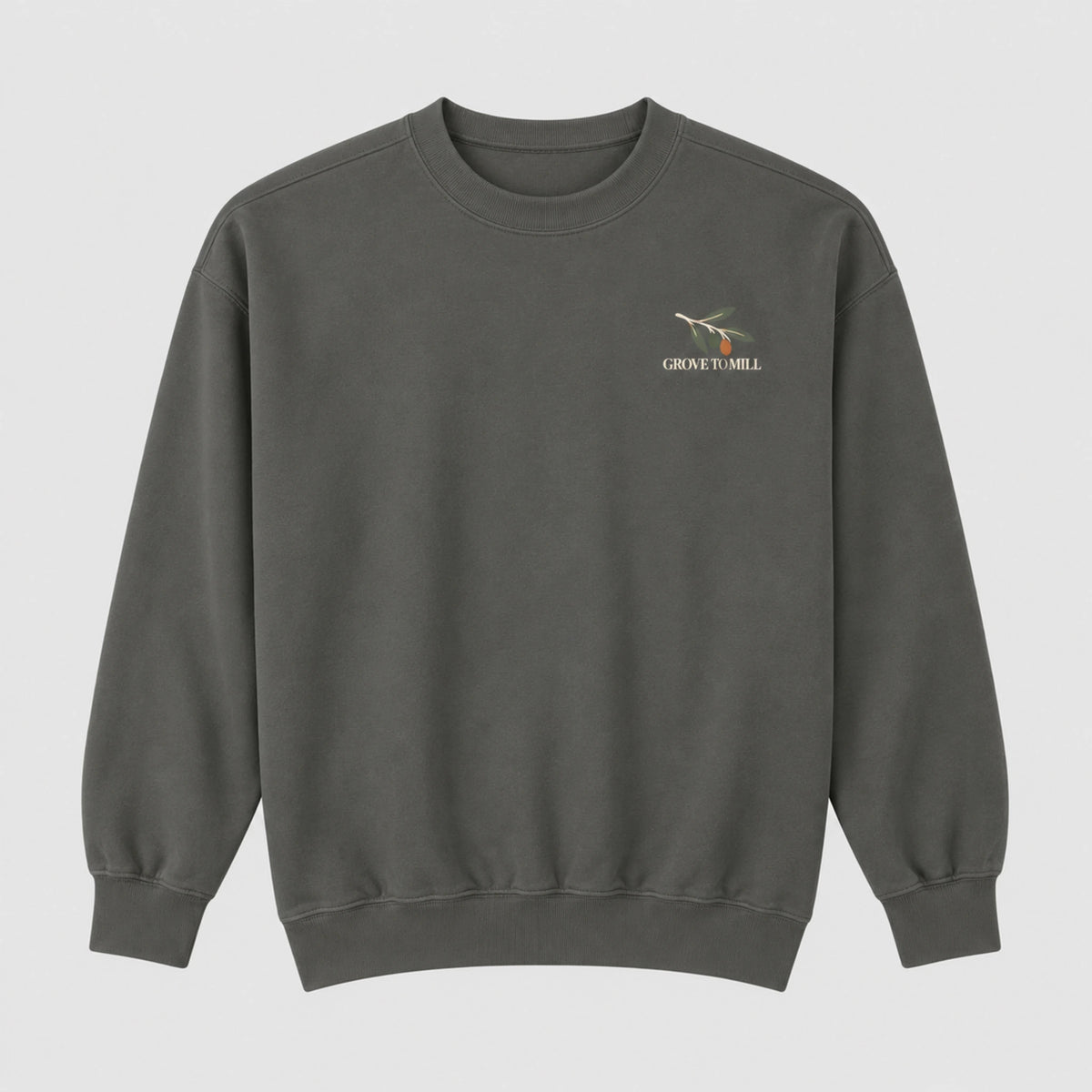 Pepper Grove to Mill Comfort Colors 1566 sweatshirt flat lay, front view with the small olive-branch Grove to Mill left-chest print.