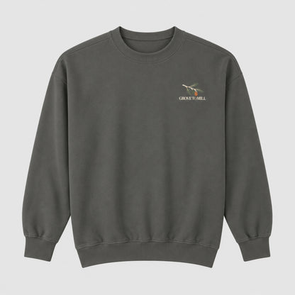 Pepper Grove to Mill Comfort Colors 1566 sweatshirt flat lay, front view with the small olive-branch Grove to Mill left-chest print.