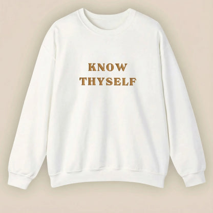 White sweatshirt with 'KNOW THYSELF' text on a beige background