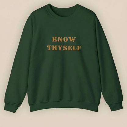 Green sweatshirt with 'KNOW THYSELF' text on a beige background