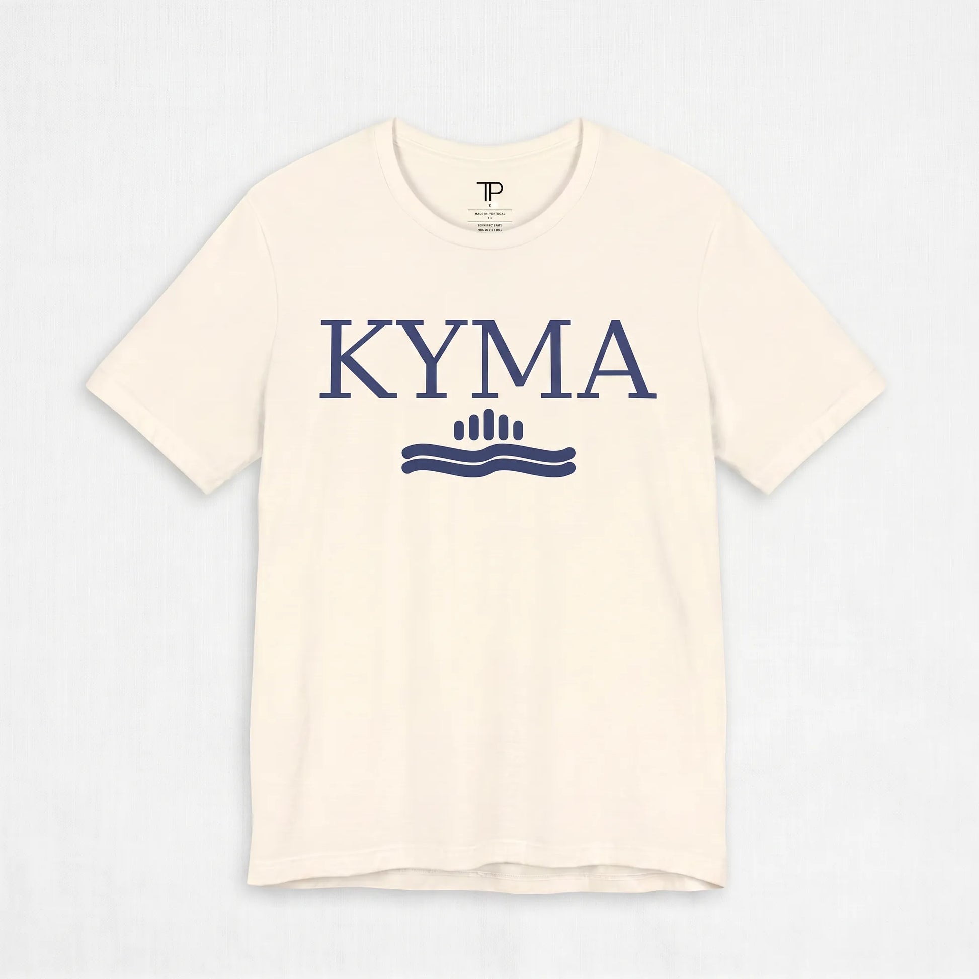 Beige t-shirt with 'KYMA' logo on a light gray background