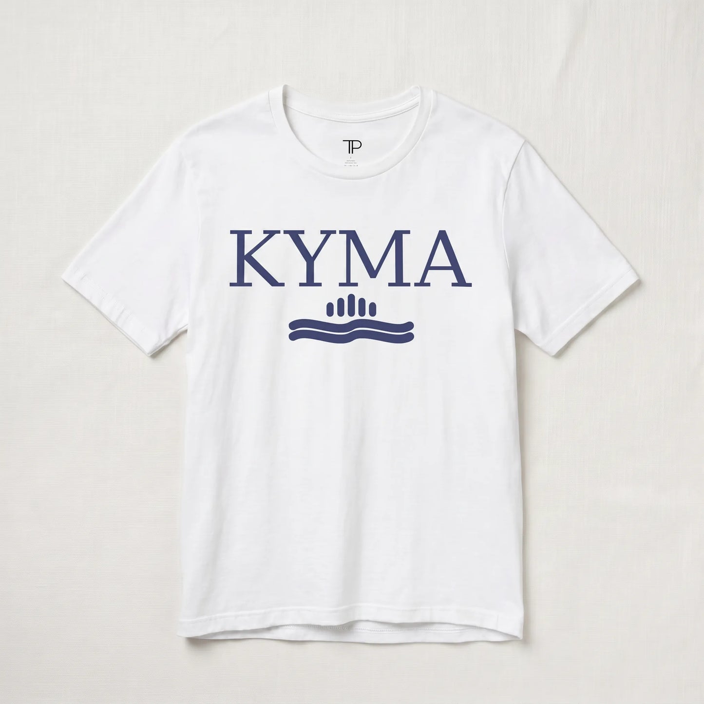 White t-shirt with 'KYMA' logo on a light gray background