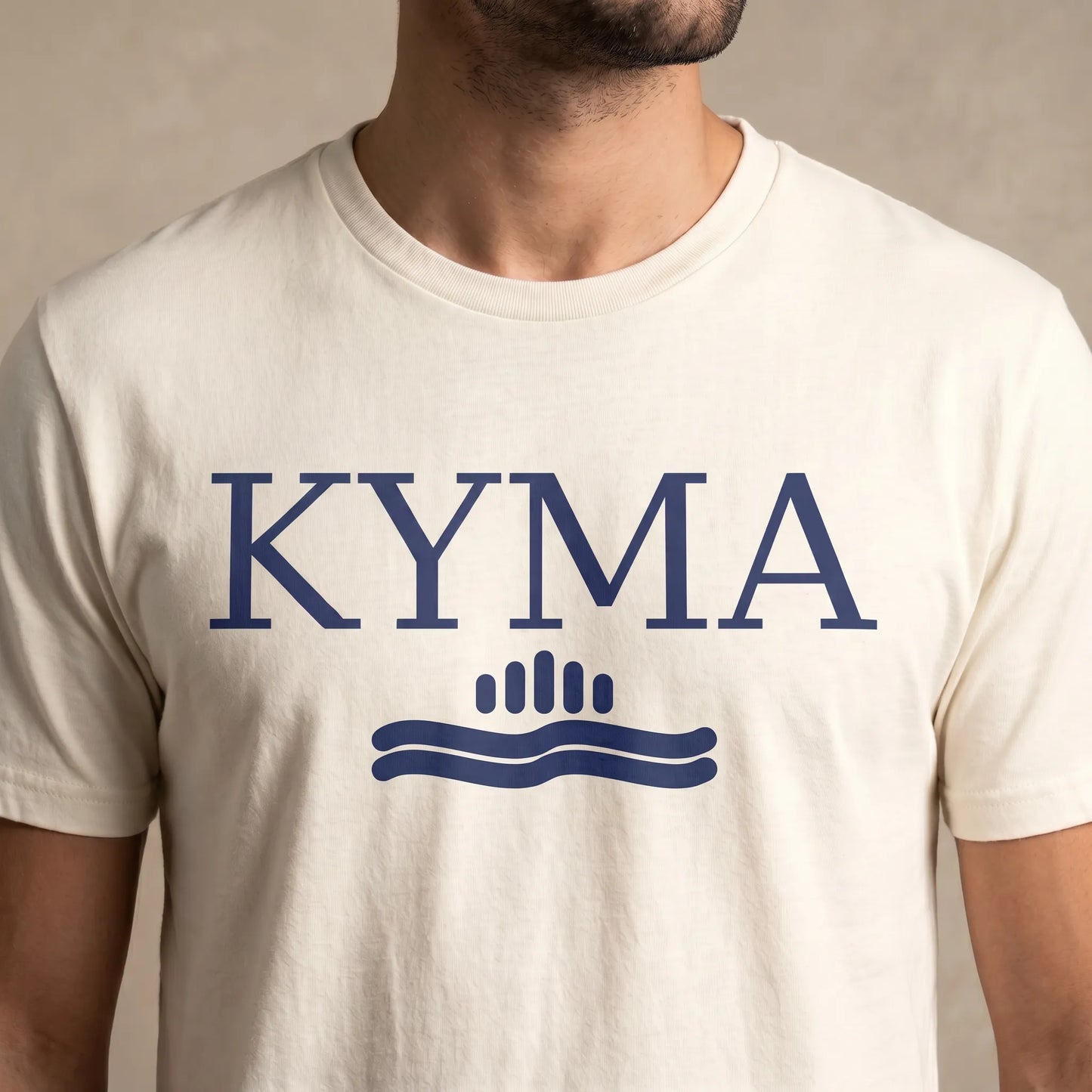 TP HERO: White t-shirt with 'KYMA' printed on it against a neutral background