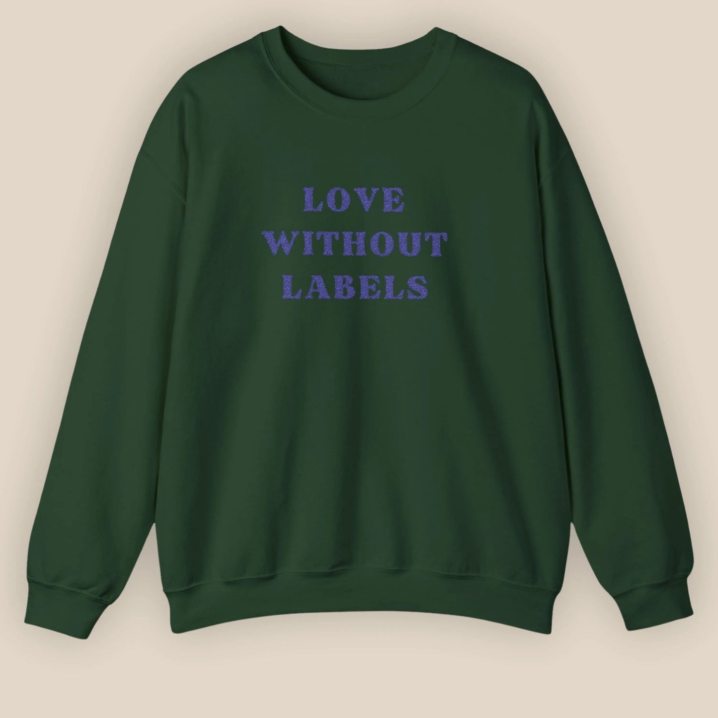 Flat lay of Love Without Labels inclusive slogan embroidered unisex crewneck sweatshirt in forest green color by ToldPrint
