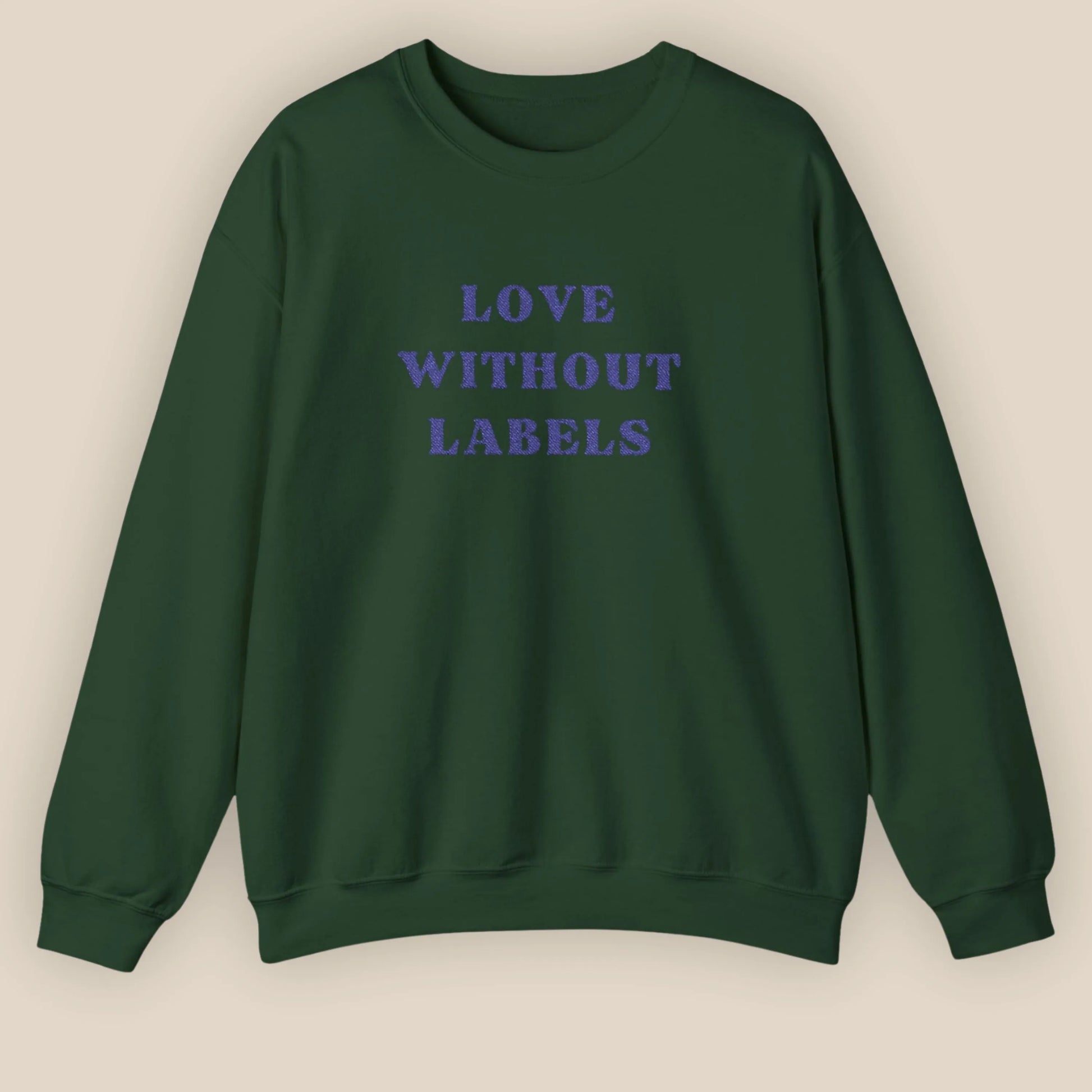 Flat lay of Love Without Labels inclusive slogan embroidered unisex crewneck sweatshirt in forest green color by ToldPrint