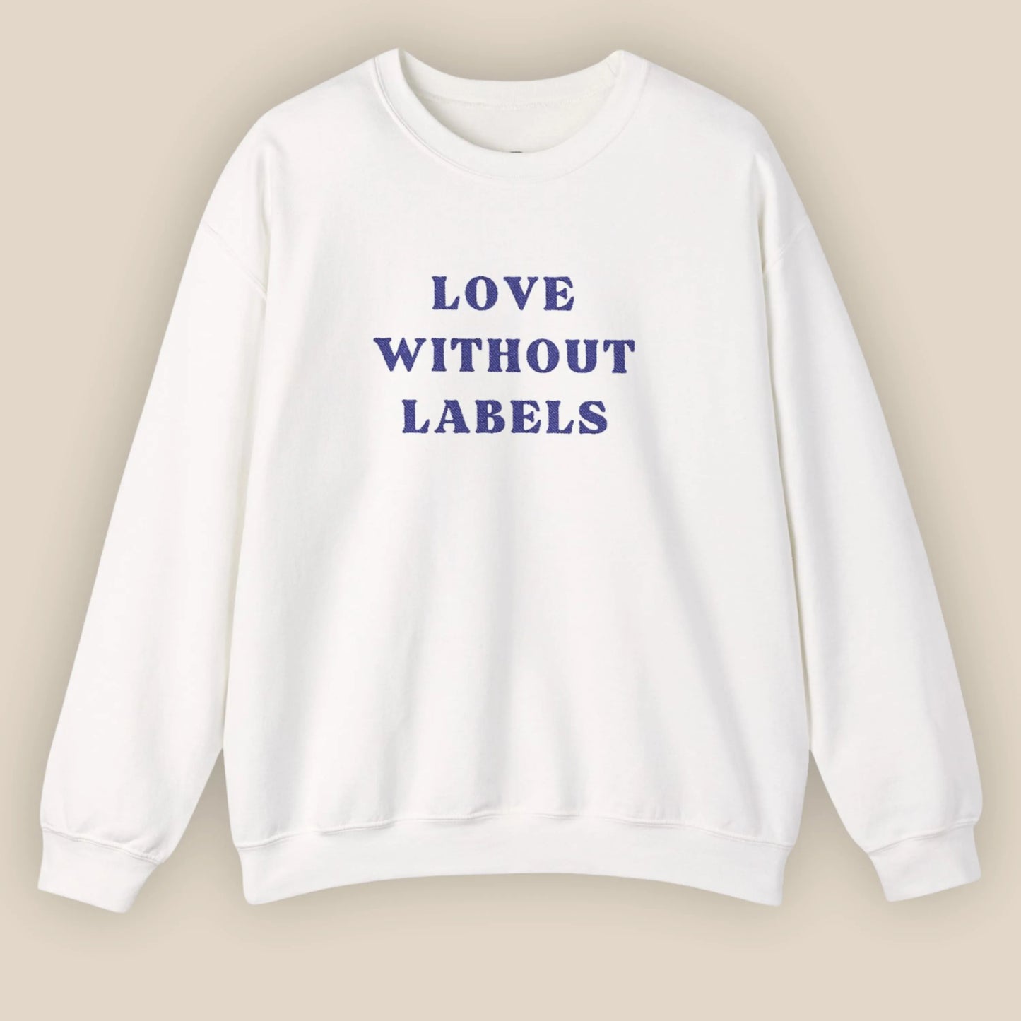 Flat lay of Love Without Labels inclusive slogan embroidered unisex crewneck sweatshirt in white color by ToldPrint