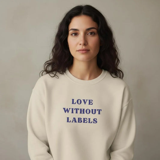 TP:HERO Model wearing Love Without Labels Greekify embroidered unisex sweatshirt by ToldPrint in a calm studio setting