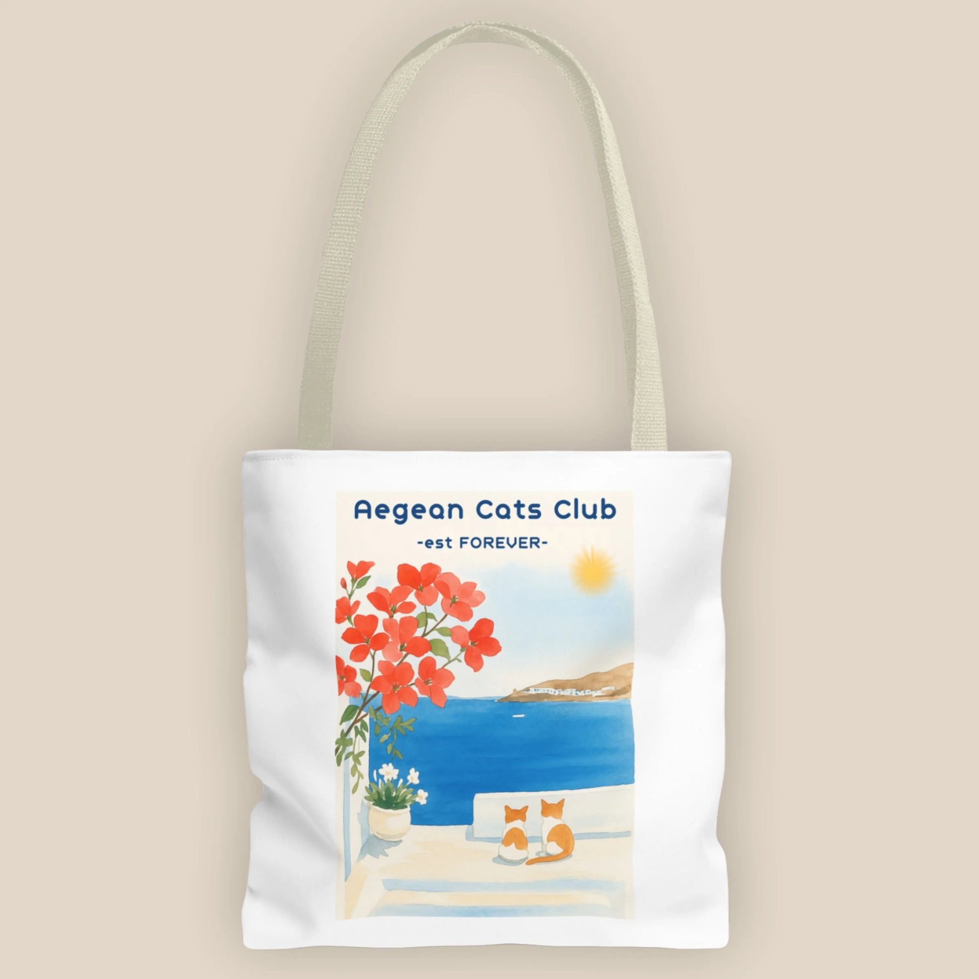 Tote bag with Aegean Cats Club design featuring a beach scene and cats.