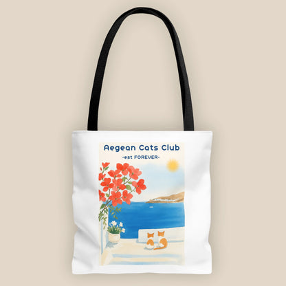 Tote bag with Aegean Cats Club design featuring a coastal scene and cats.