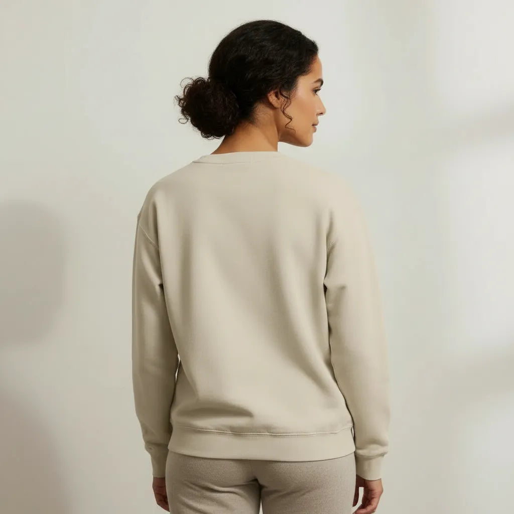 Back view of Philoxenia First unisex embroidered crewneck sweatshirt showing relaxed fit