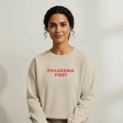 TP:HERO Model wearing Philoxenia First Greek hospitality embroidered unisex sweatshirt by ToldPrint in a calm studio setting