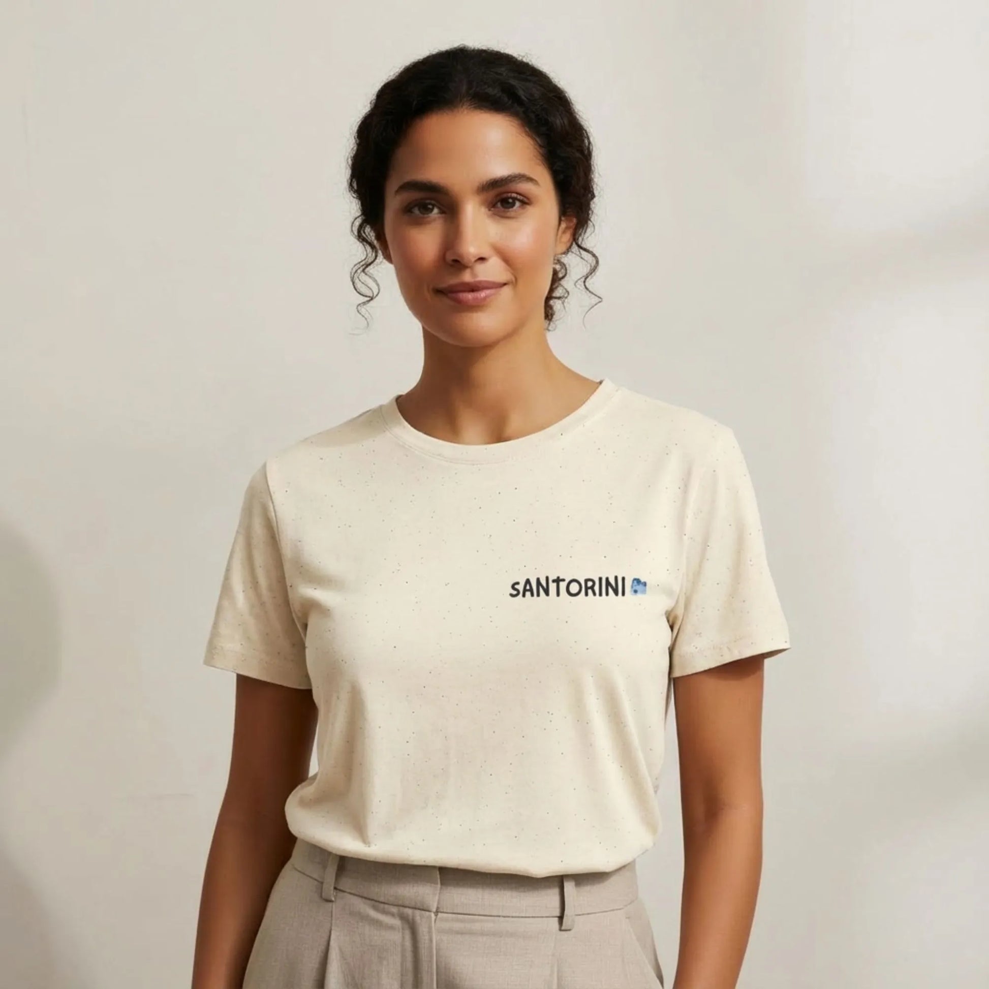 TP:HERO Model wearing Santorini Island Map travel t-shirt by ToldPrint in a calm studio