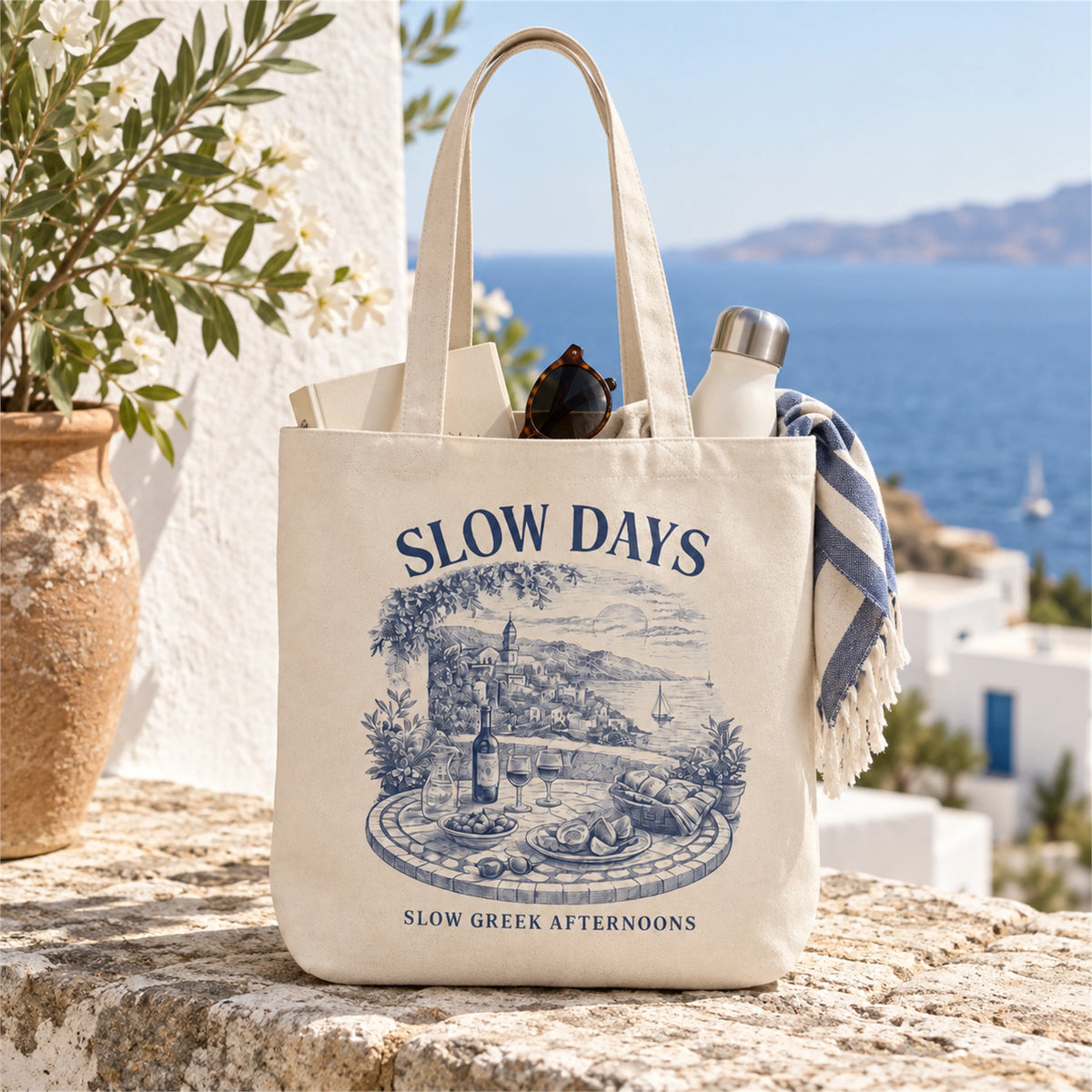Slow Days tote bag product shot outdoors with sea view