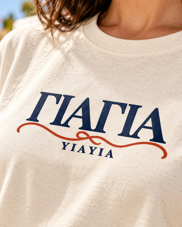 YIAYIA Greek heritage Natural T-shirt, close-up of navy and terracotta Greek grandmother design
