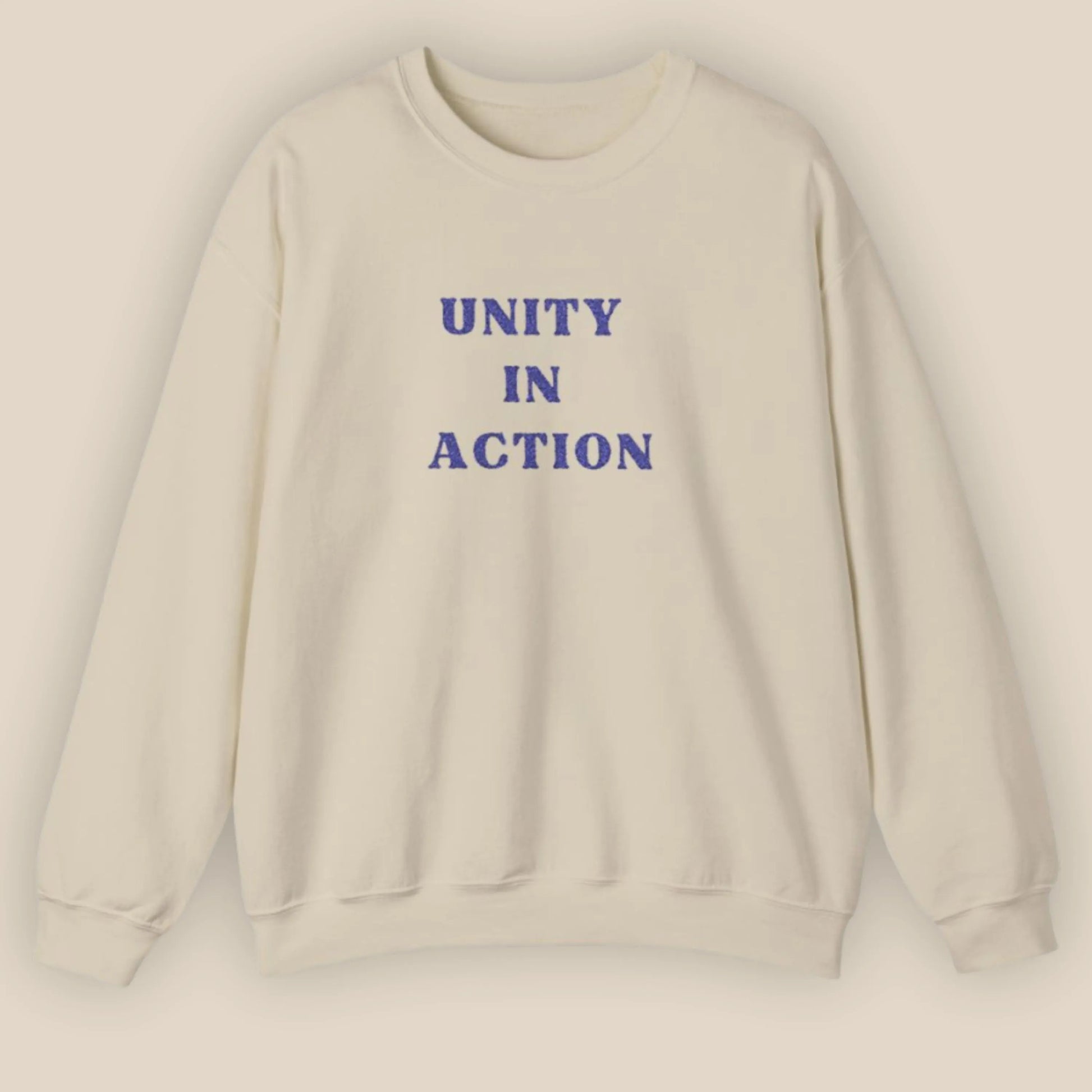 Flat lay of Unity in Action Greek solidarity slogan embroidered unisex hoodie by ToldPrint