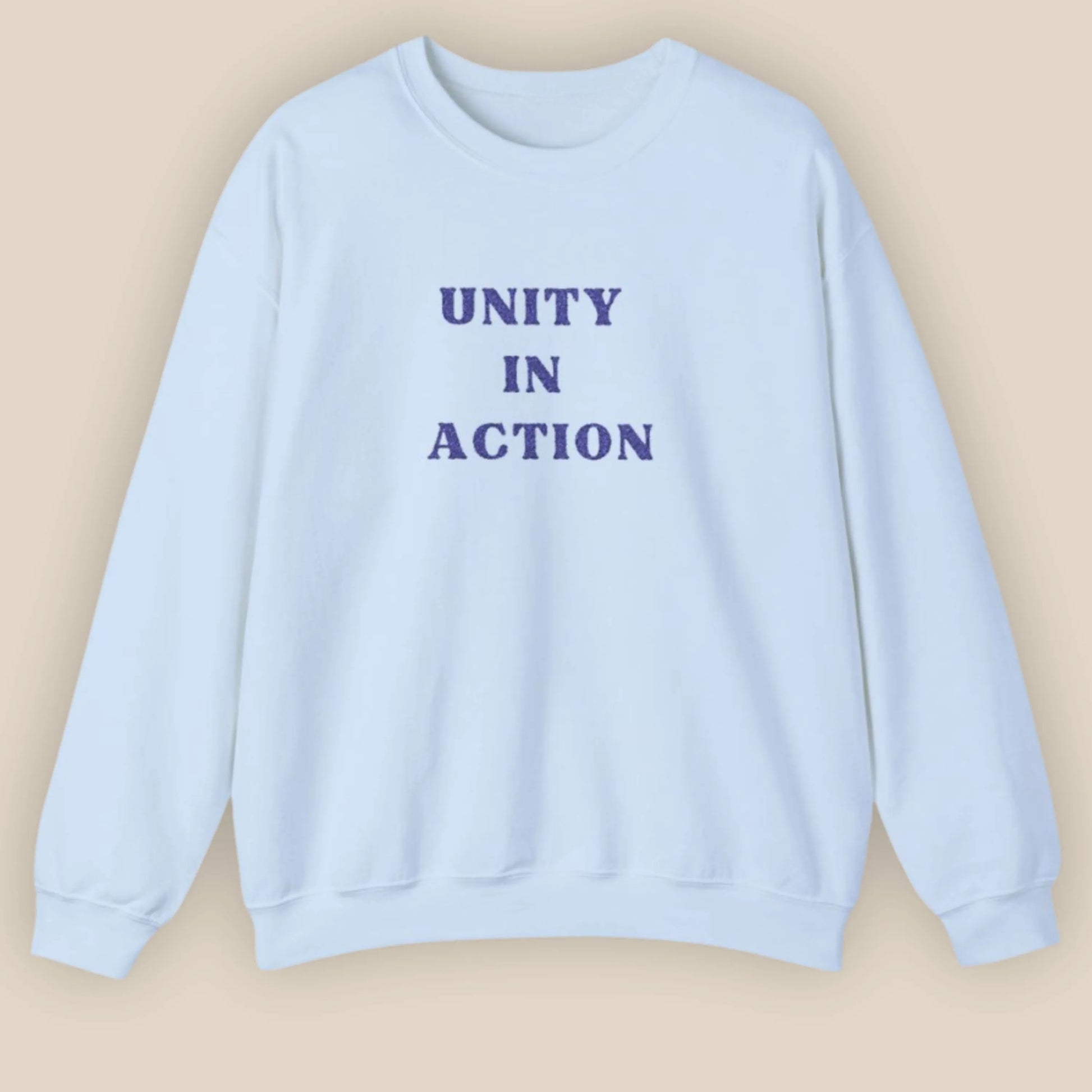 Flat lay of Unity in Action Greek solidarity slogan embroidered unisex hoodie by ToldPrint