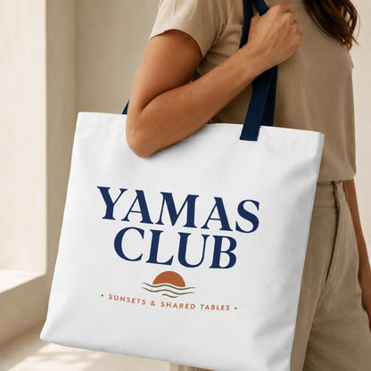 TP HERO: Person holding a white tote bag with 'Yamas Club' text and logo.