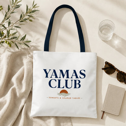 White tote bag with 'Yamas Club' text and logo on a light background