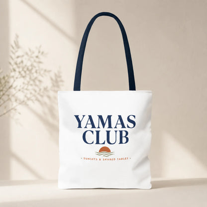 Tote bag with 'Yamas Club' text and logo on a beige background