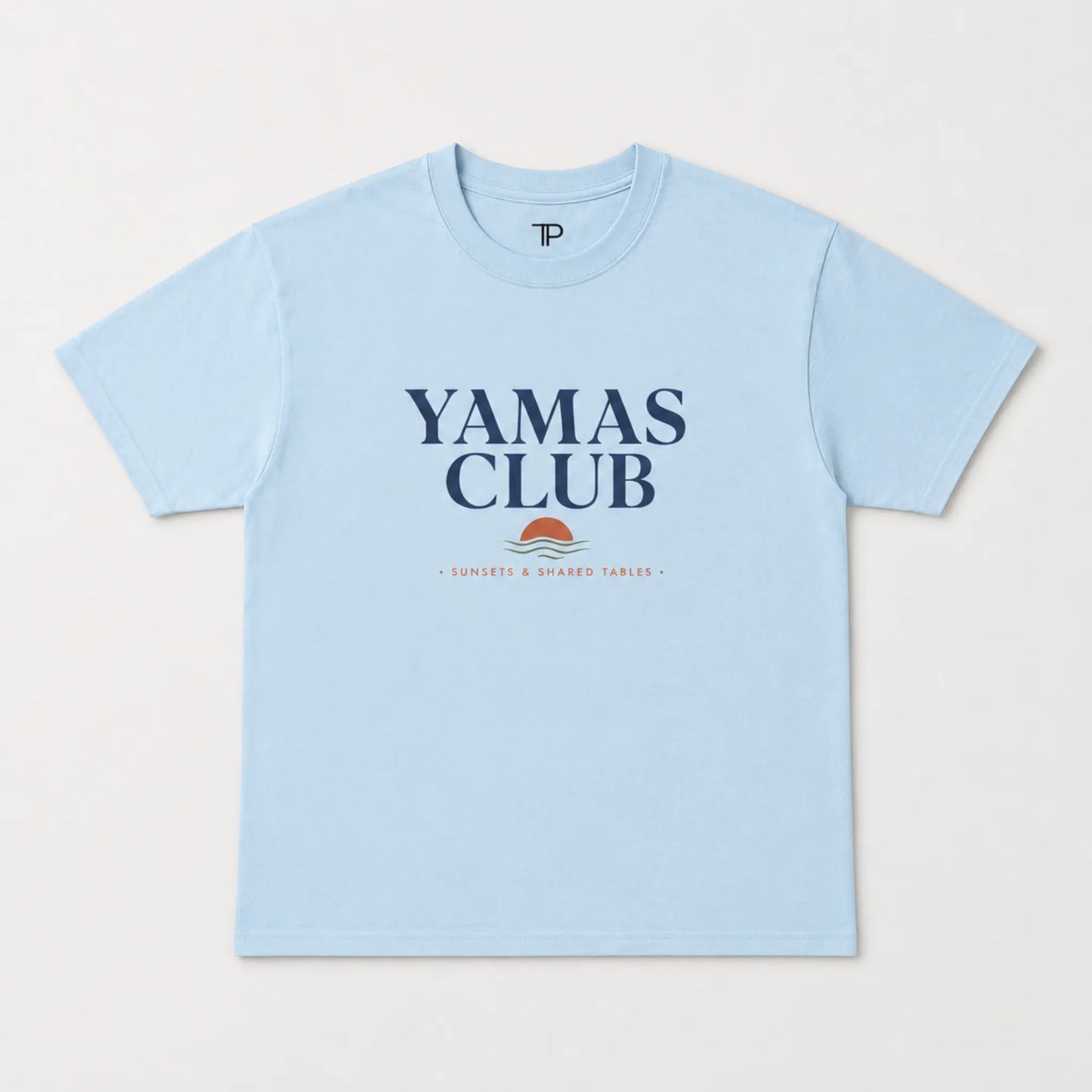 Light blue t-shirt with 'Yamas Club' text on a white background