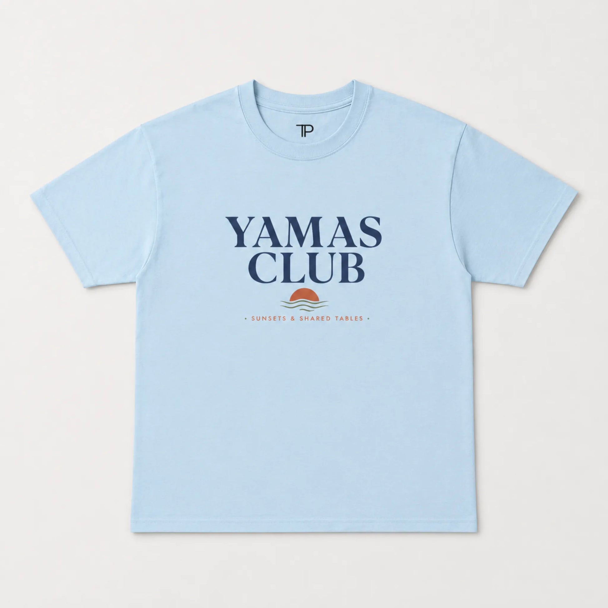 Light blue t-shirt with 'Yamas Club' text on a white background